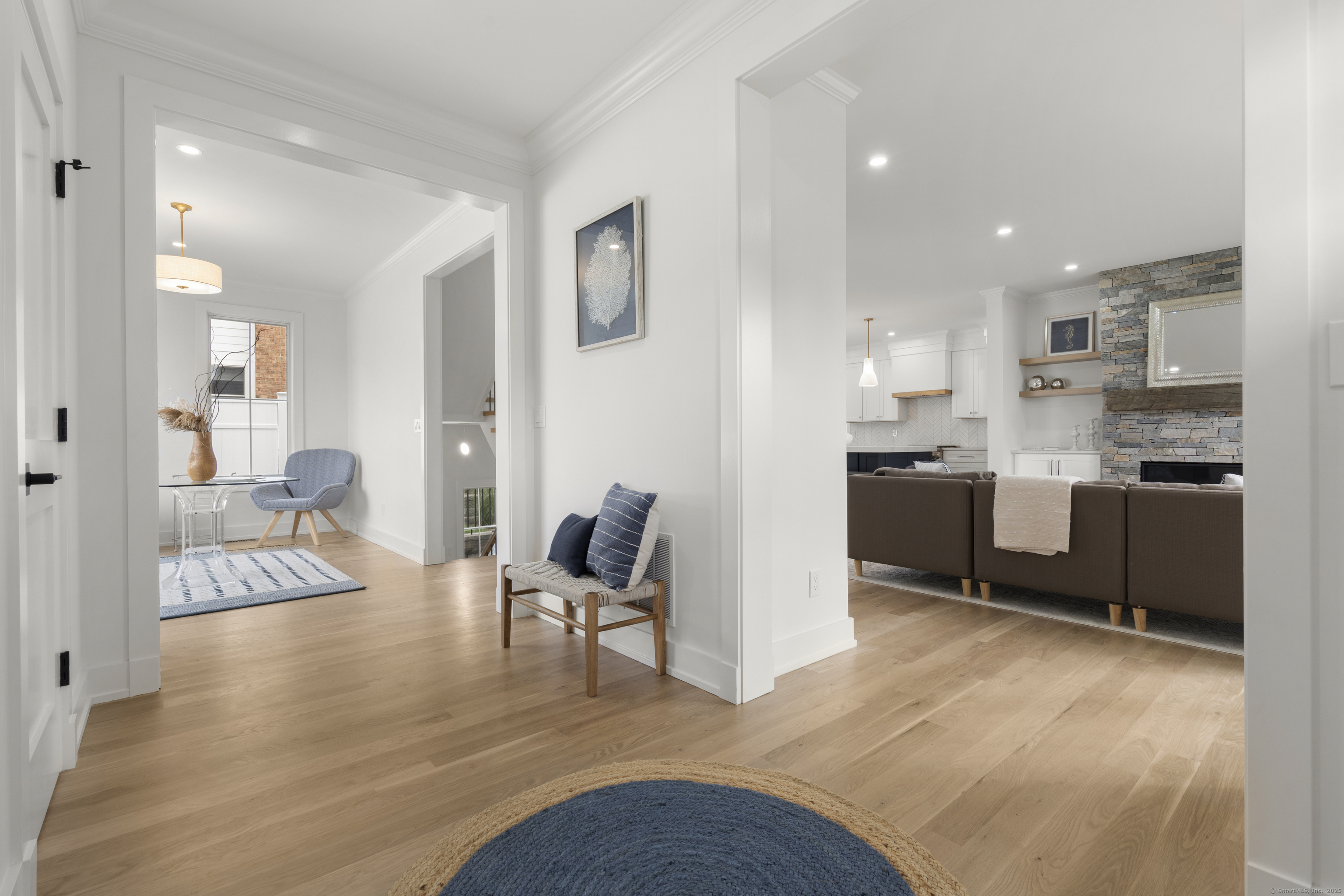 706 Judd Street Fairfield, CT 06824 - Photo 3 of 40 a open kitchen with cabinets and wooden floor