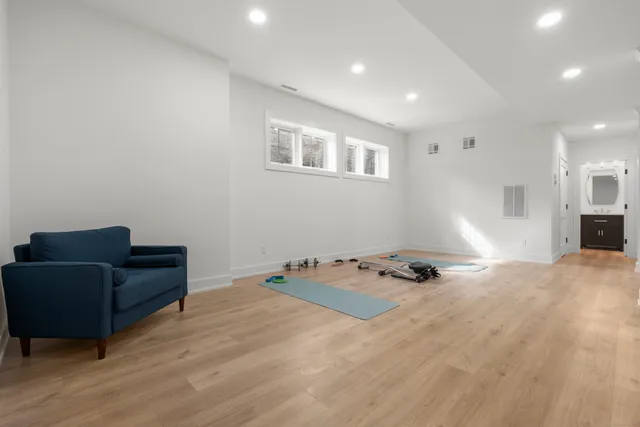 a view of a livingroom with furniture and wooden floor