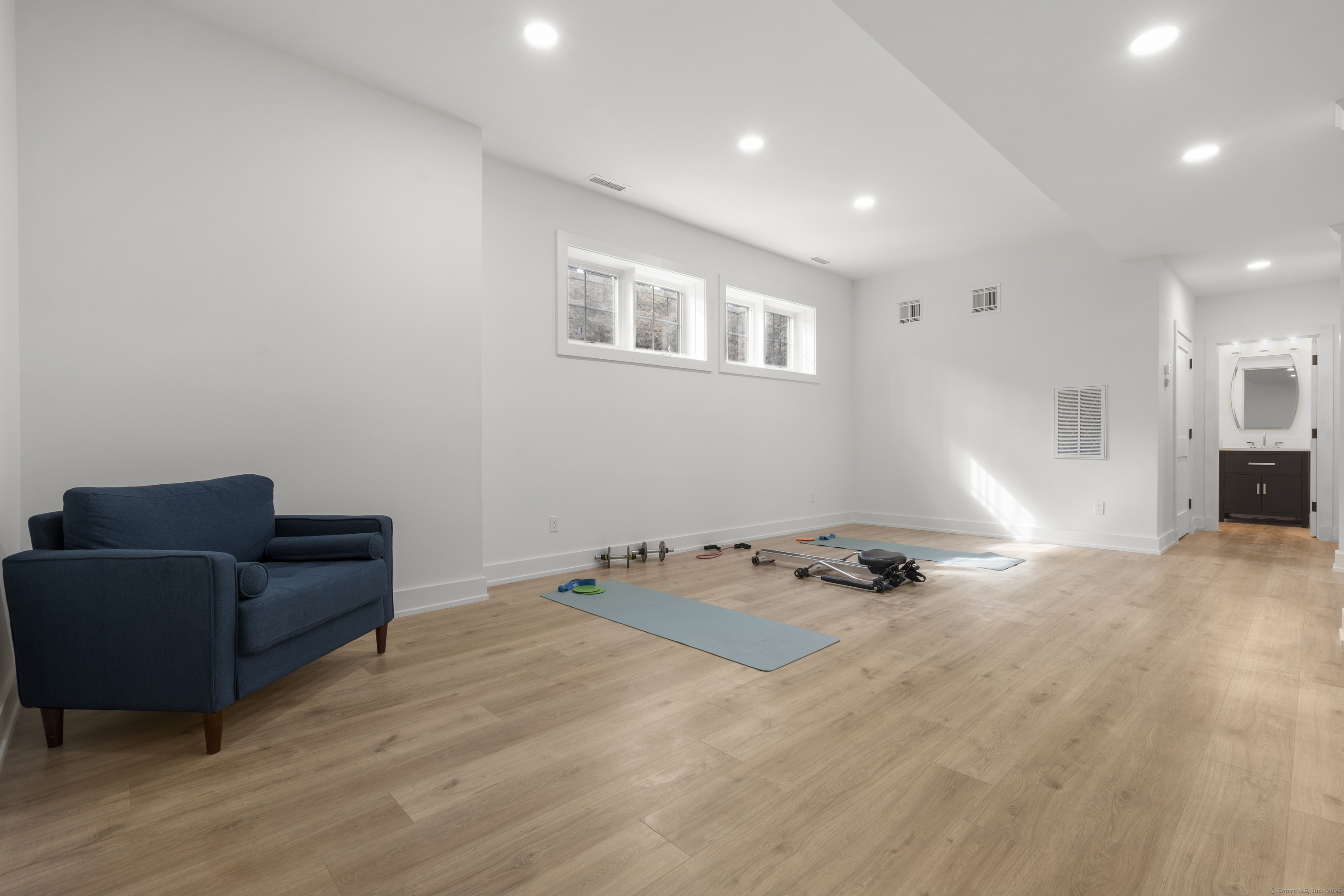 706 Judd Street Fairfield, CT 06824 - Photo 32 of 40 a view of a livingroom with furniture and wooden floor
