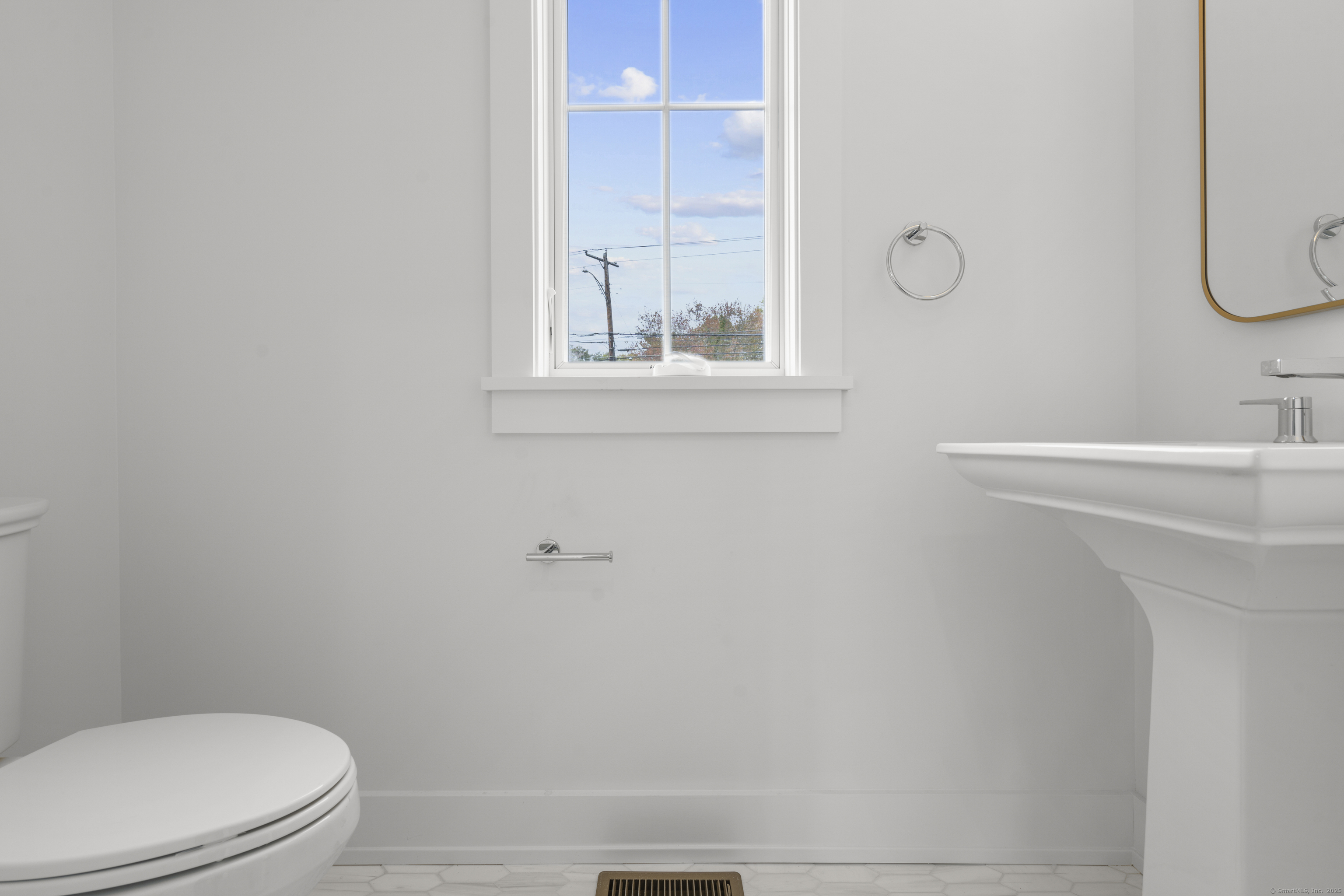 706 Judd Street Fairfield, CT 06824 - Photo 5 of 40 a bathroom with a sink mirror and toilet