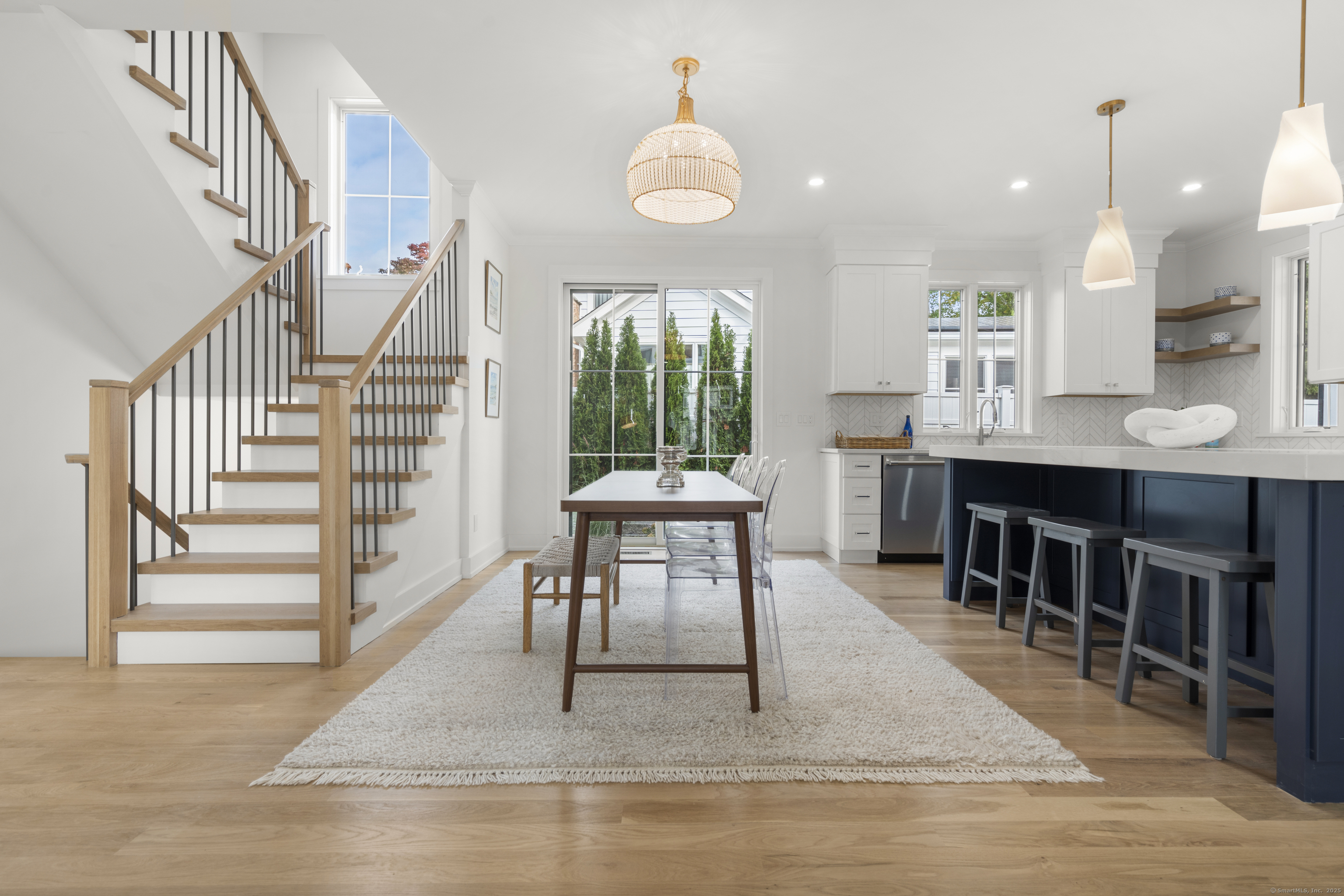 706 Judd Street Fairfield, CT 06824 - Photo 9 of 40 a view of a dining room with furniture window and wooden floor