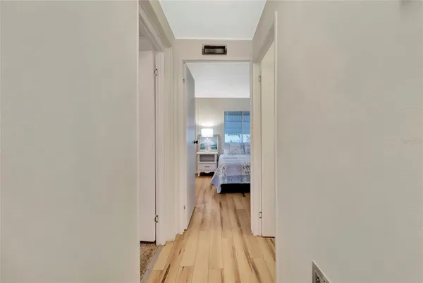 a view of a bedroom from a hallway