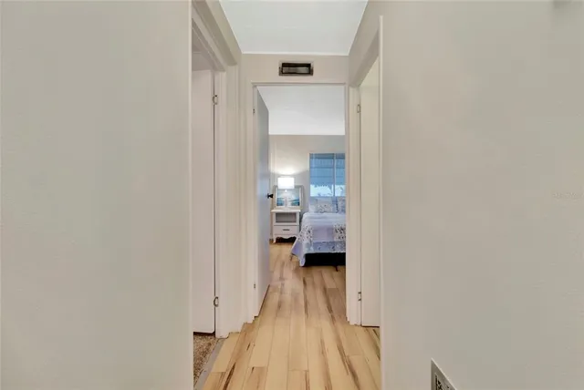 a view of a bedroom from a hallway