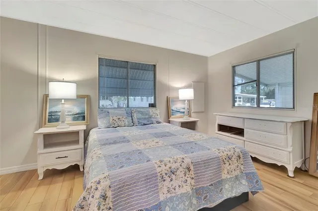 a bedroom with a large bed and a window