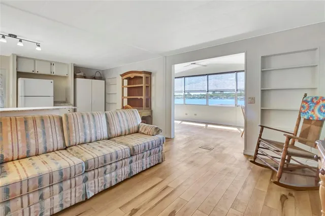 a living room with a couch and a stove top oven