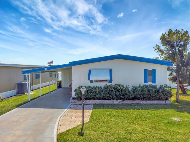 a room with furniture and kitchen view