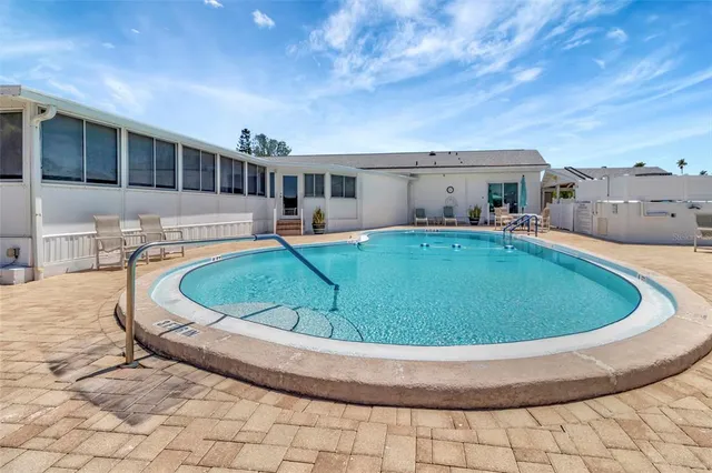 a view of a lake with boats and trees in the background