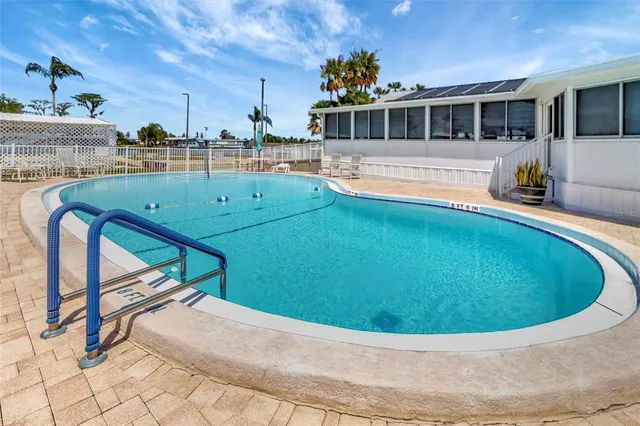 an aerial view of a house with a swimming pool