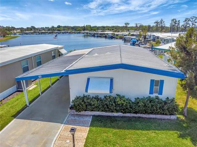a view of a swimming pool with an outdoor seating and a garden