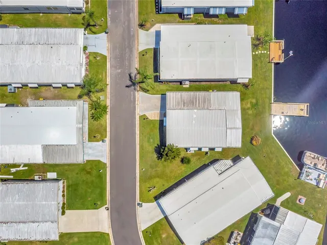 a house view with swimming pool and ocean view