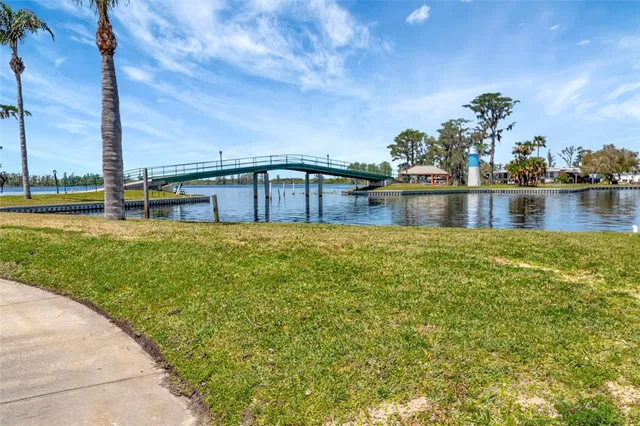 a kitchen with stainless steel appliances granite countertop lots of counter top space and wooden floor
