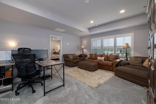 a bedroom with a bed and a night stand