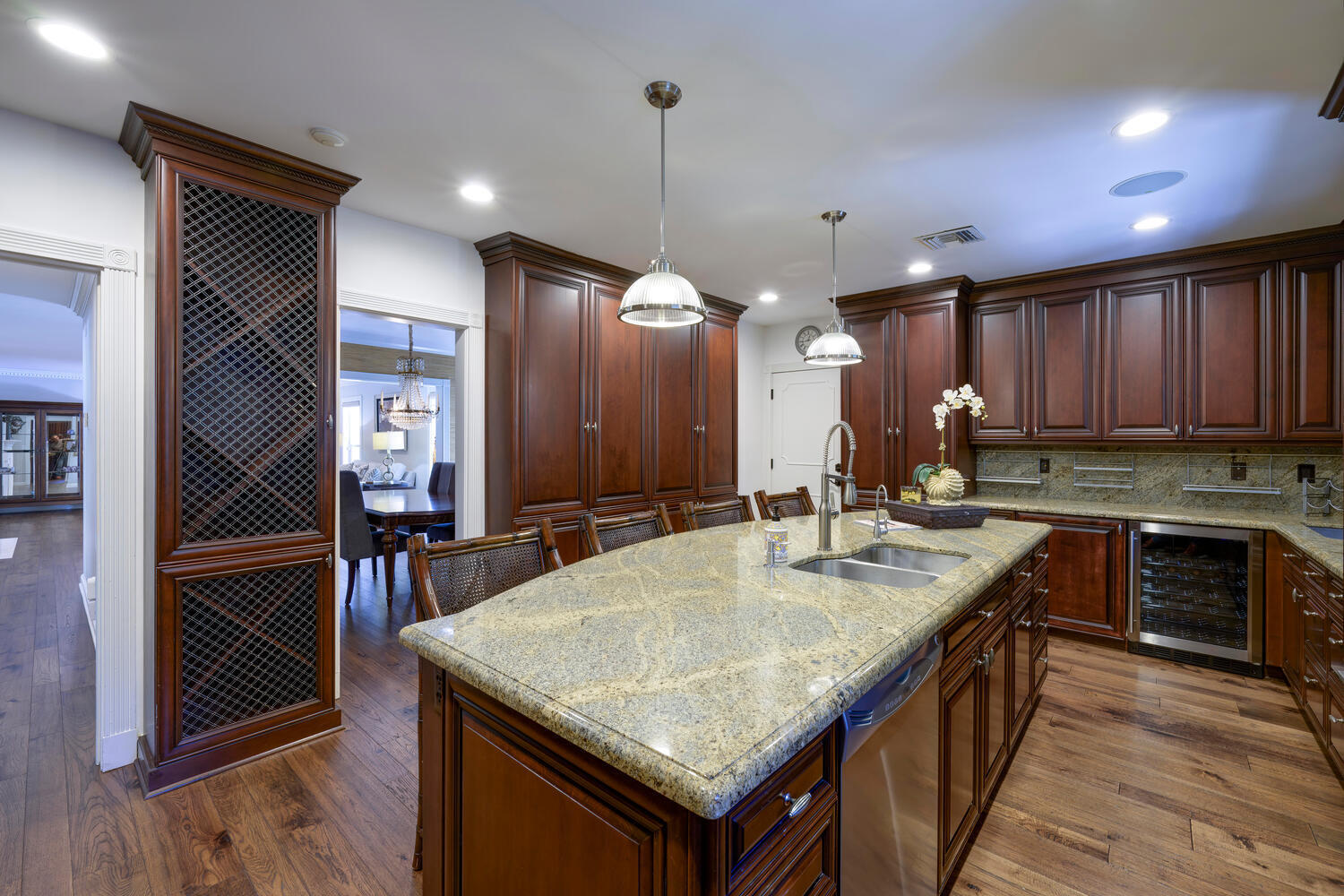 1125 Harbor Drive Delray Beach, FL 33483 - Photo 26 of 41 a kitchen with kitchen island granite countertop a sink a counter top space and stainless steel appliances