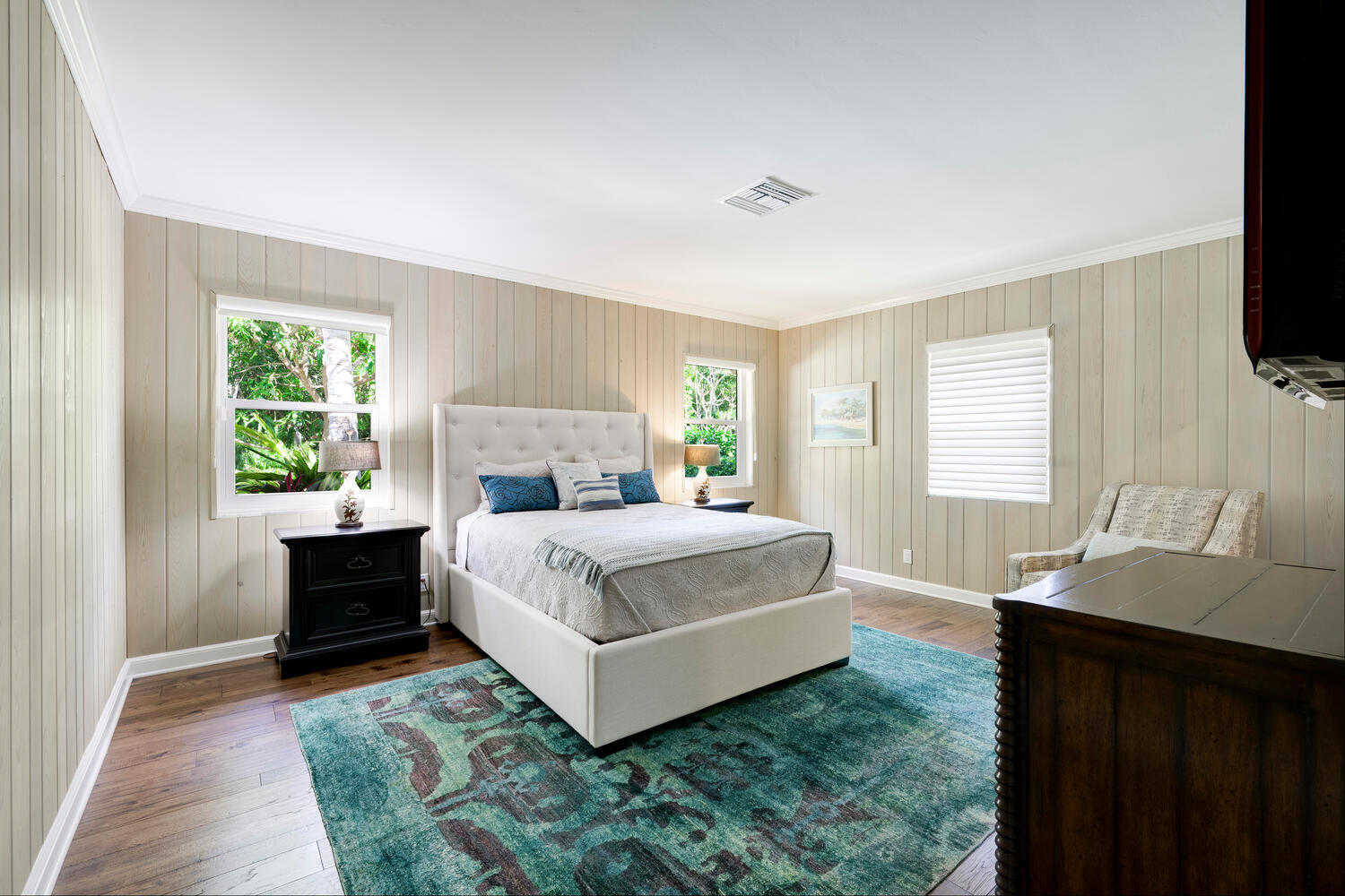 1125 Harbor Drive Delray Beach, FL 33483 - Photo 30 of 41 a spacious bedroom with a bed and a flat screen tv