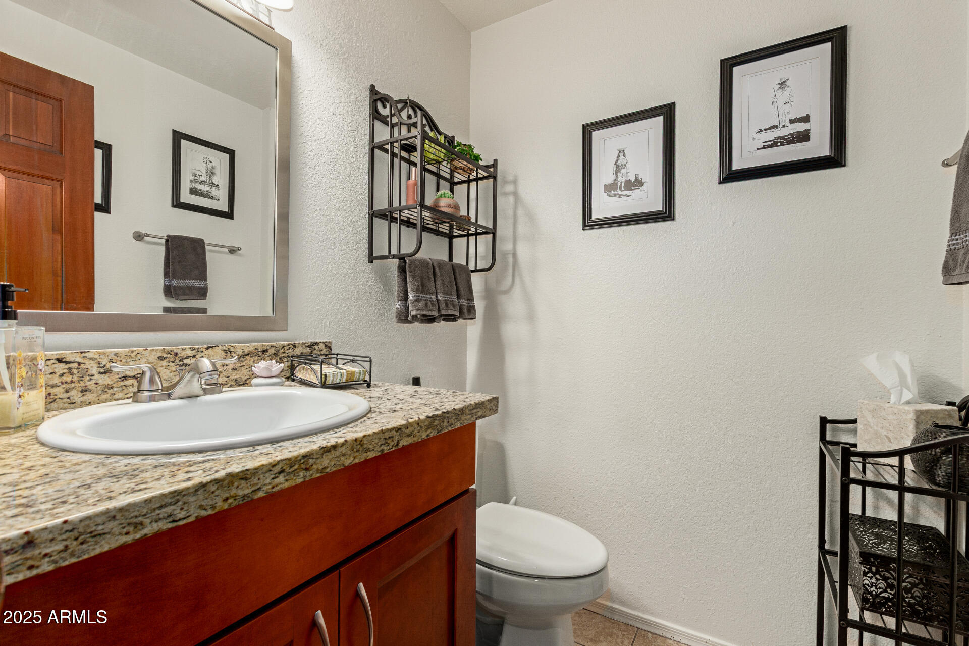 6231 West Grandview Road Glendale, AZ 85306 - Photo 18 of 35 a bathroom with a granite countertop sink mirror and toilet