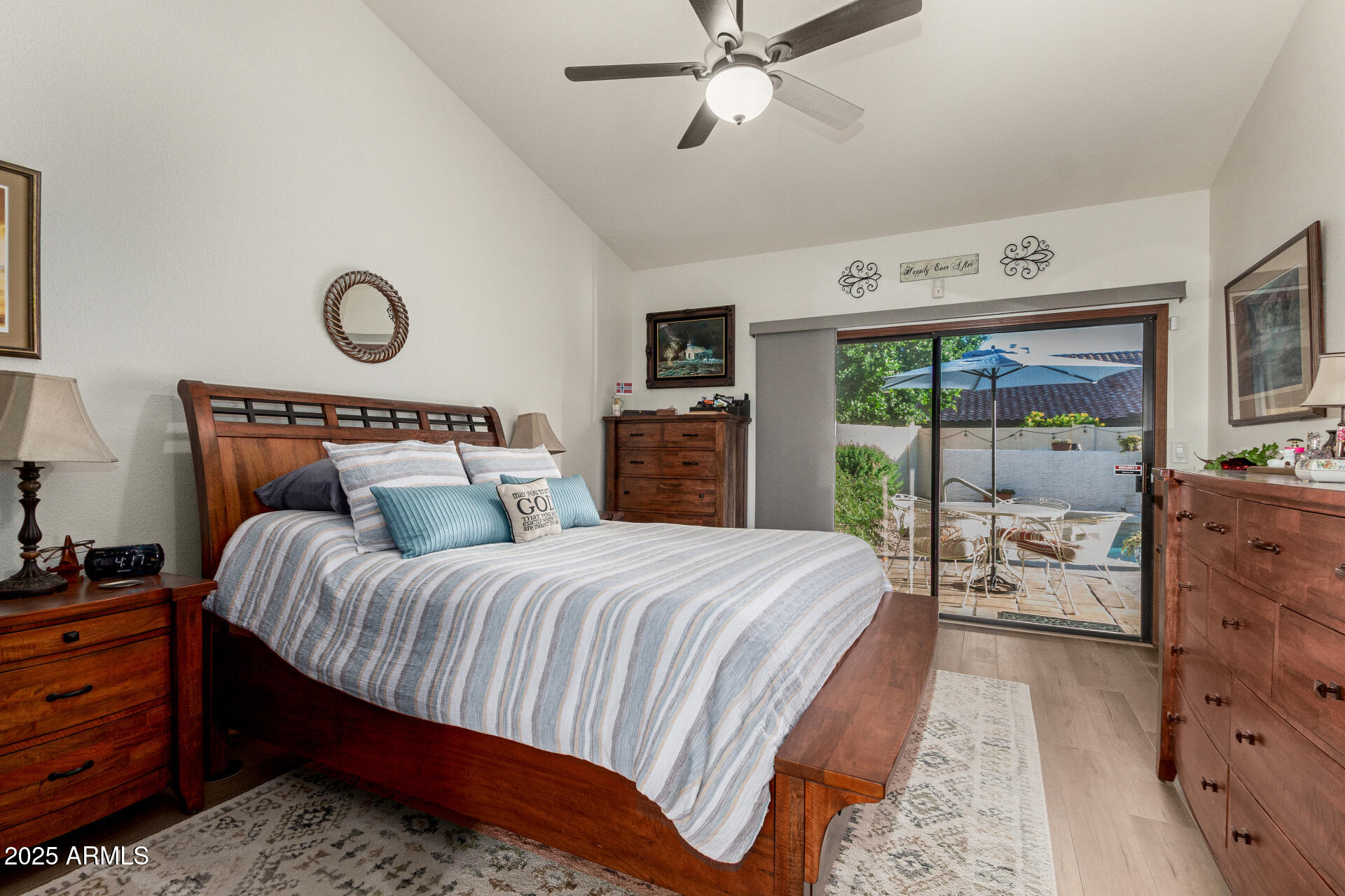 6231 West Grandview Road Glendale, AZ 85306 - Photo 19 of 35 a bedroom with a bed and wooden floor
