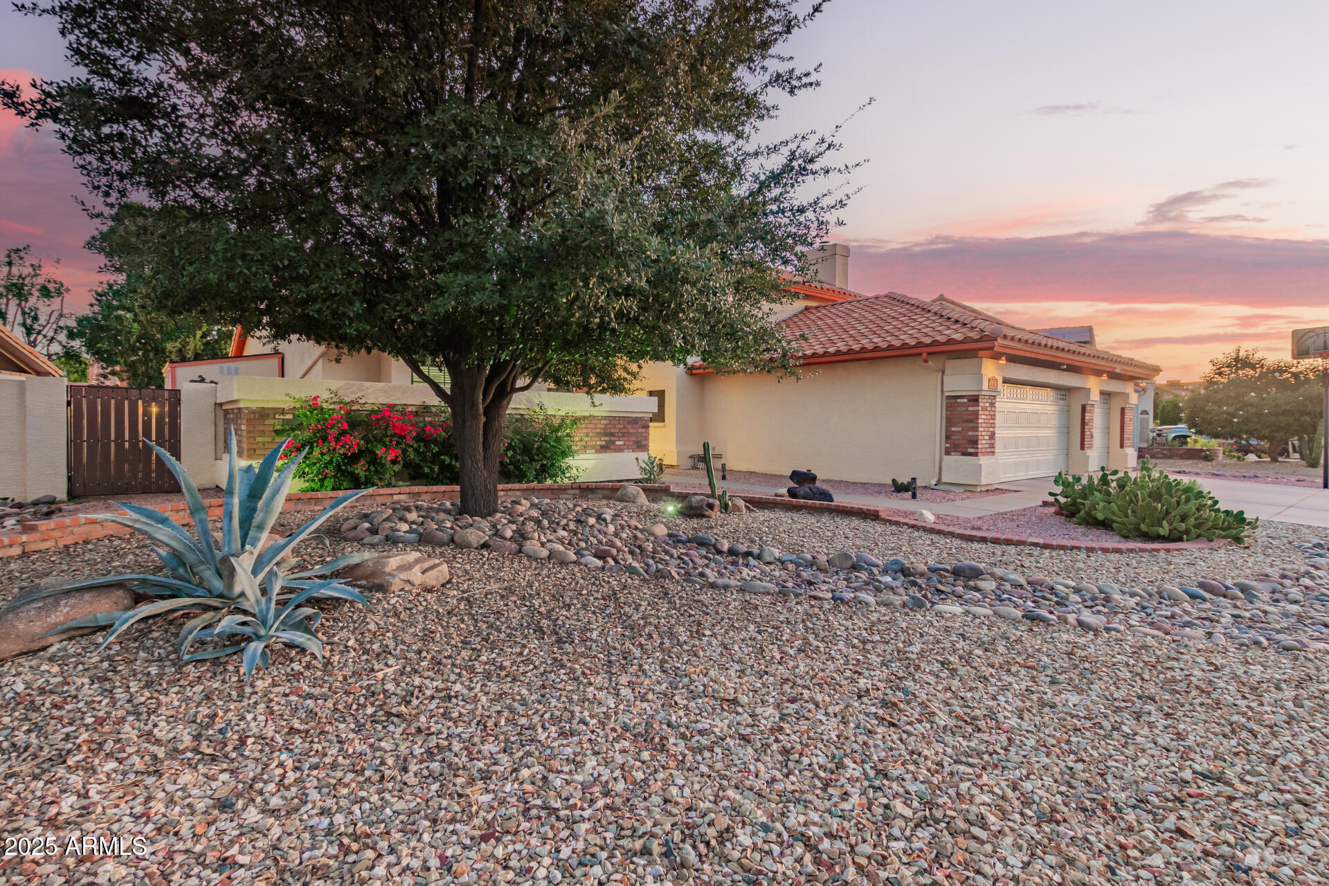 6231 West Grandview Road Glendale, AZ 85306 - Photo 2 of 35 a view of a house with wooden fence