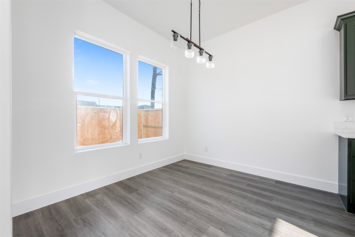 1304 Duff Lane Houston, TX 77022 - Photo 11 of 33 a view of empty room with wooden floor and fan