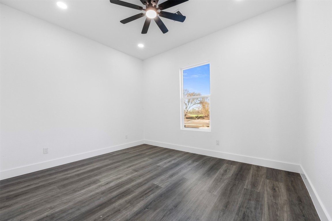 1304 Duff Lane Houston, TX 77022 - Photo 25 of 33 wooden floor in an empty room with a window