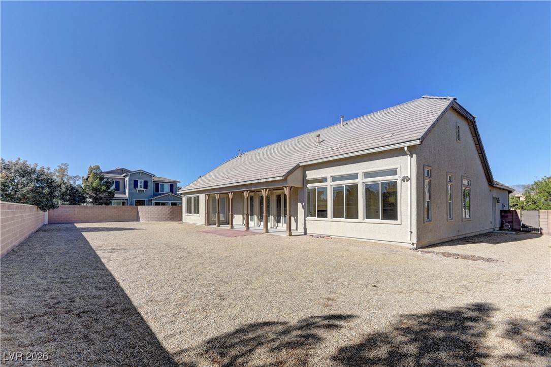 6383 Radiant Rapture Avenue Las Vegas, NV 89131 - Photo 17 of 17 Back of property with a patio area, a fenced backyard, and stucco siding