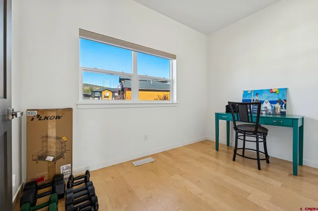 a bedroom with a bed and a table in it