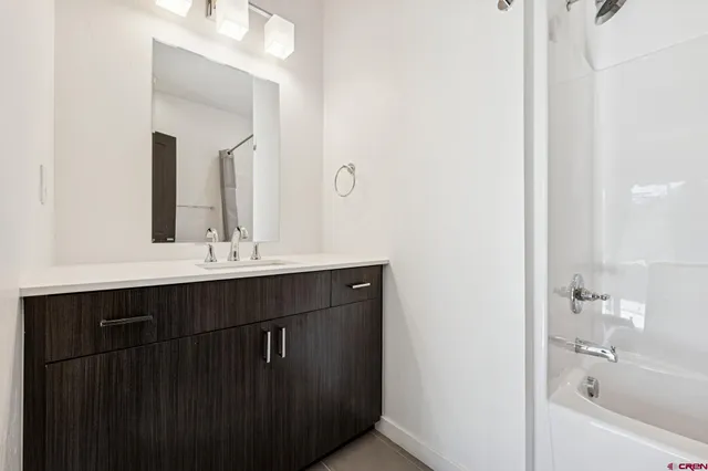 a bathroom with a sink and a bathtub