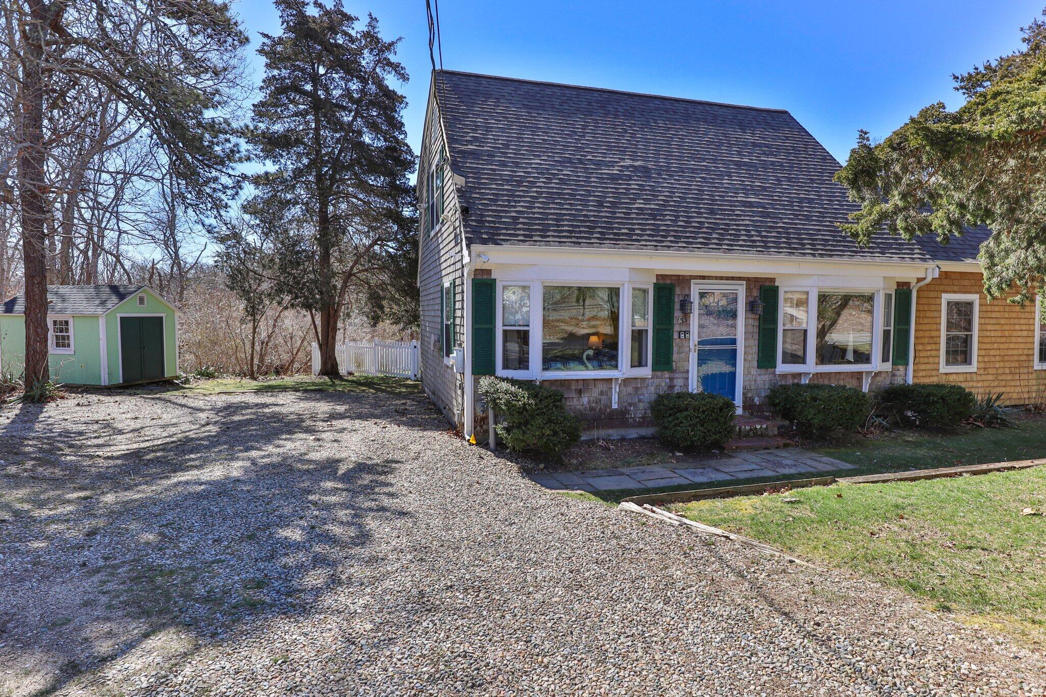 153 Long Road Harwich Port, MA 02646 - Photo 37 of 44 front view of a house with a yard