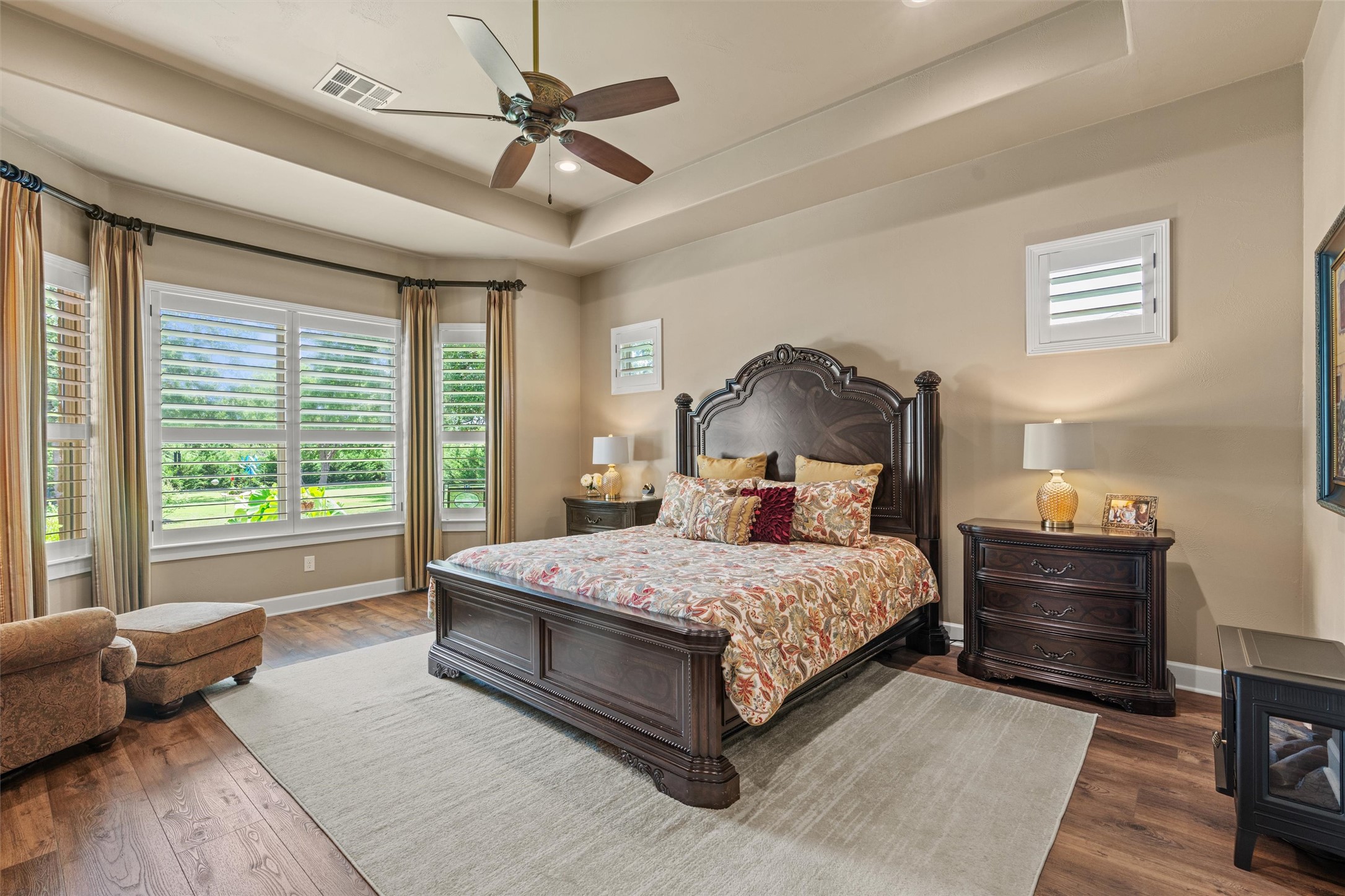 104 Adobe Cove Georgetown, TX 78633 - Photo 12 of 39 Bedroom featuring dark wood-type flooring, a raised ceiling, ceiling fan, and recessed lighting