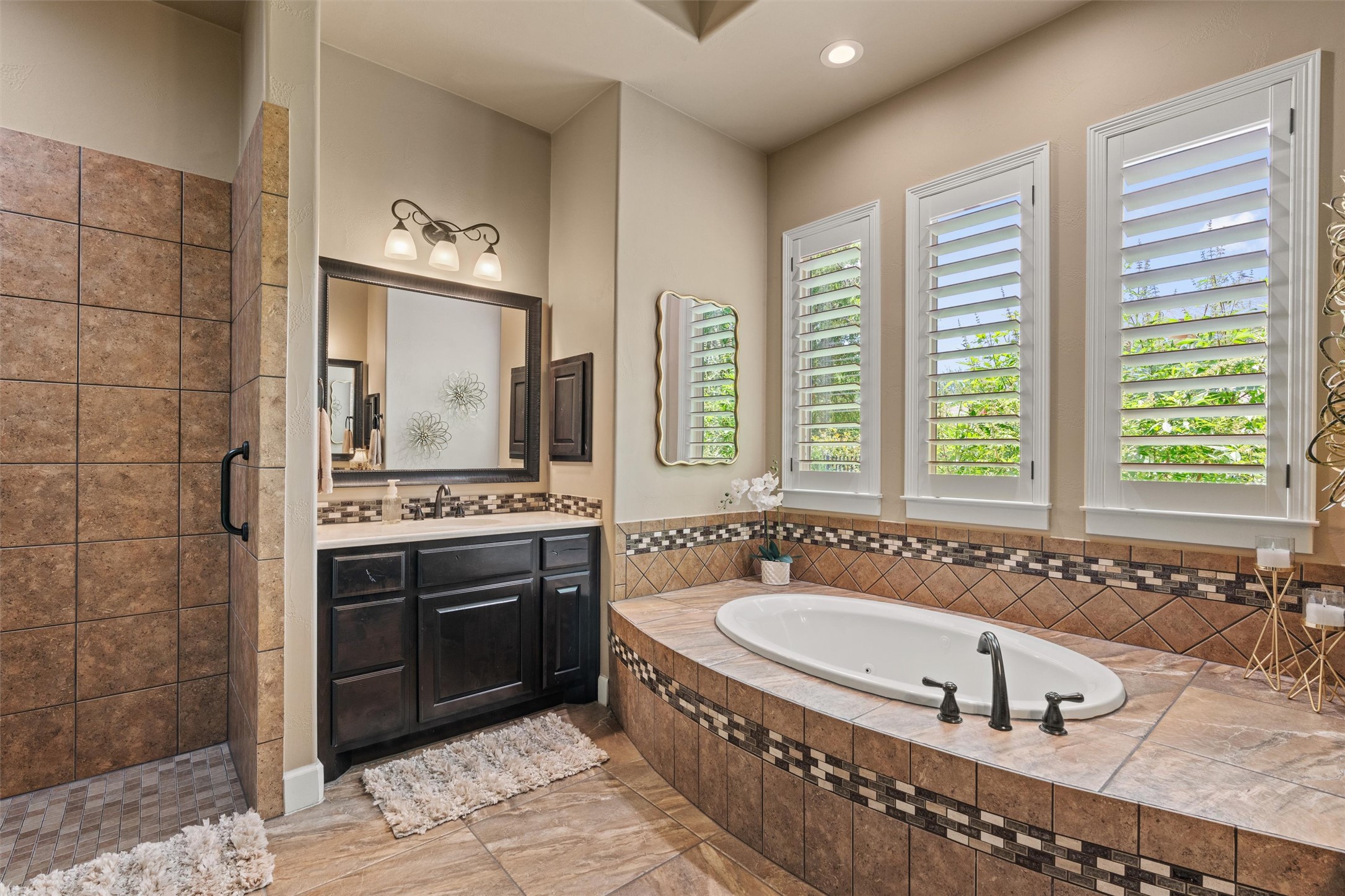 104 Adobe Cove Georgetown, TX 78633 - Photo 15 of 39 Bathroom featuring a shower stall, vanity, a bath, and recessed lighting