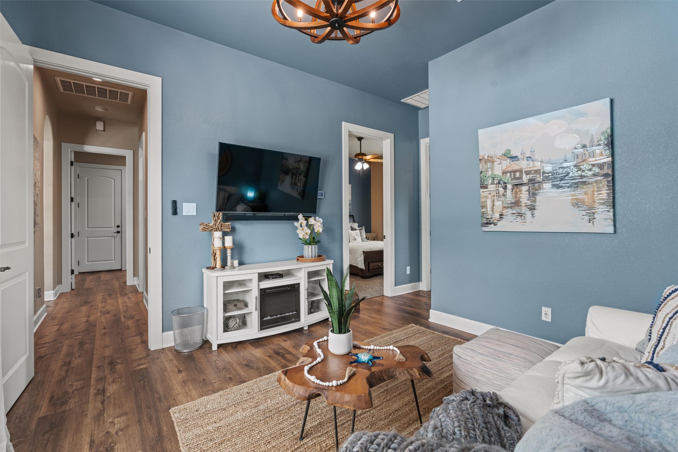 104 Adobe Cove Georgetown, TX 78633 - Photo 17 of 39 Living area featuring dark wood finished floors and suspended lighting