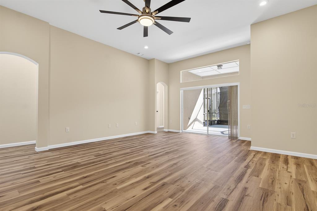 6002 Martinglade Place Lithia, FL 33547 - Photo 24 of 62 wooden floor in an empty room with a window