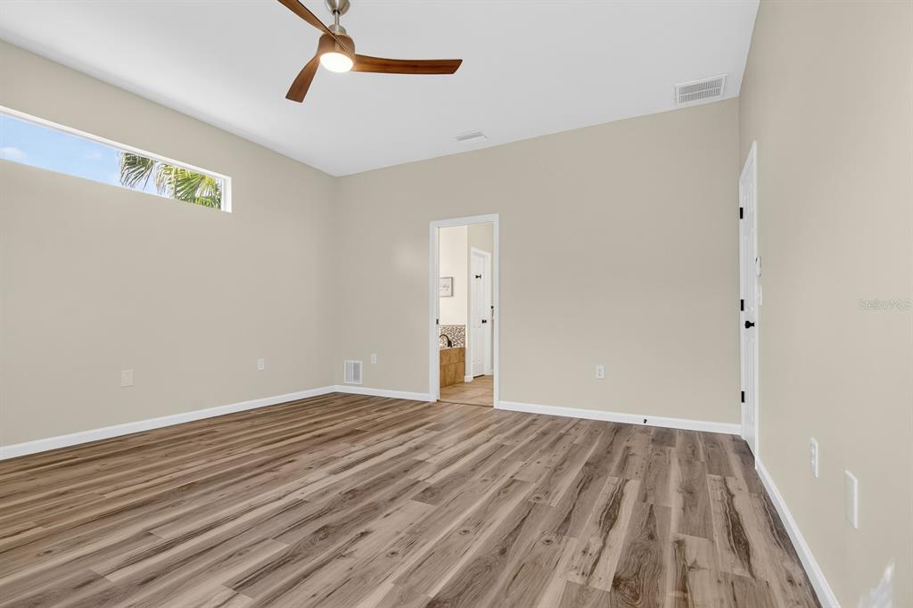 6002 Martinglade Place Lithia, FL 33547 - Photo 27 of 62 a view of empty room with wooden floor