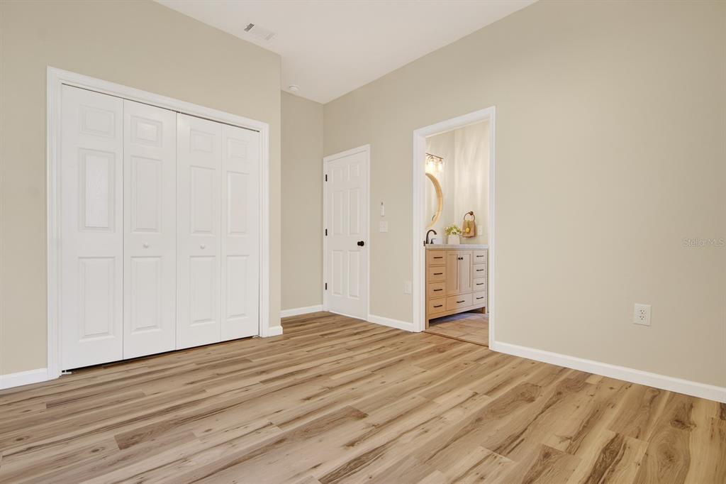 6002 Martinglade Place Lithia, FL 33547 - Photo 29 of 62 a view of an empty room with wooden floor