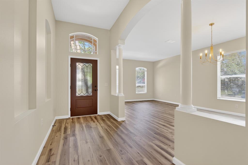 6002 Martinglade Place Lithia, FL 33547 - Photo 3 of 62 a view of a room with wooden floor and window