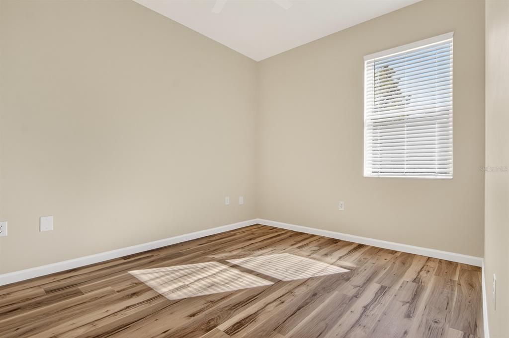 6002 Martinglade Place Lithia, FL 33547 - Photo 36 of 62 a view of a room with wooden floor and a window