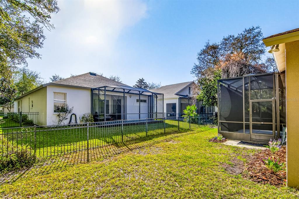 6002 Martinglade Place Lithia, FL 33547 - Photo 51 of 62 a view of a house with swimming pool and a yard