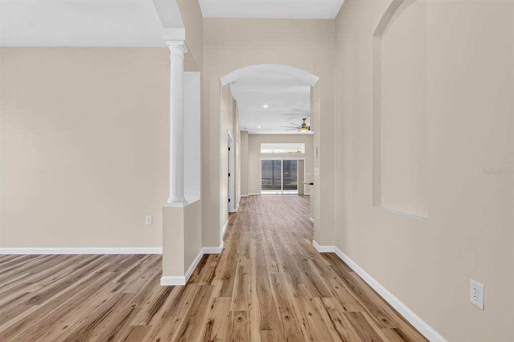6002 Martinglade Place Lithia, FL 33547 - Photo 7 of 62 a view of a room with wooden floor