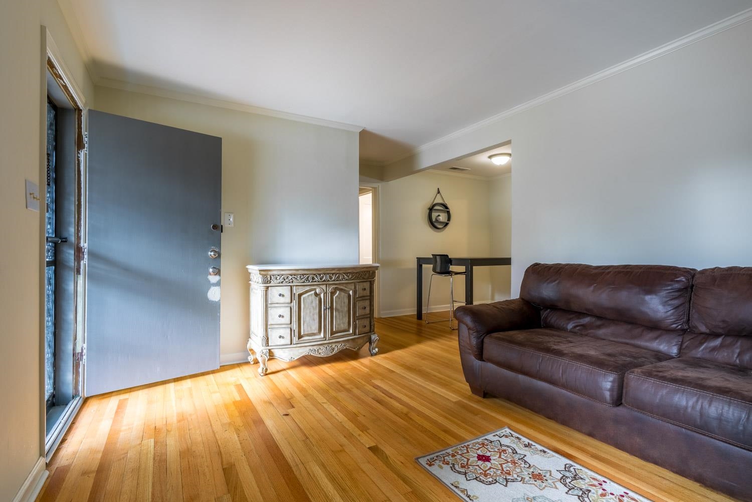 4500 Helene Road Memphis, TN 38117 - Photo 5 of 25 a living room with a couch and a rug