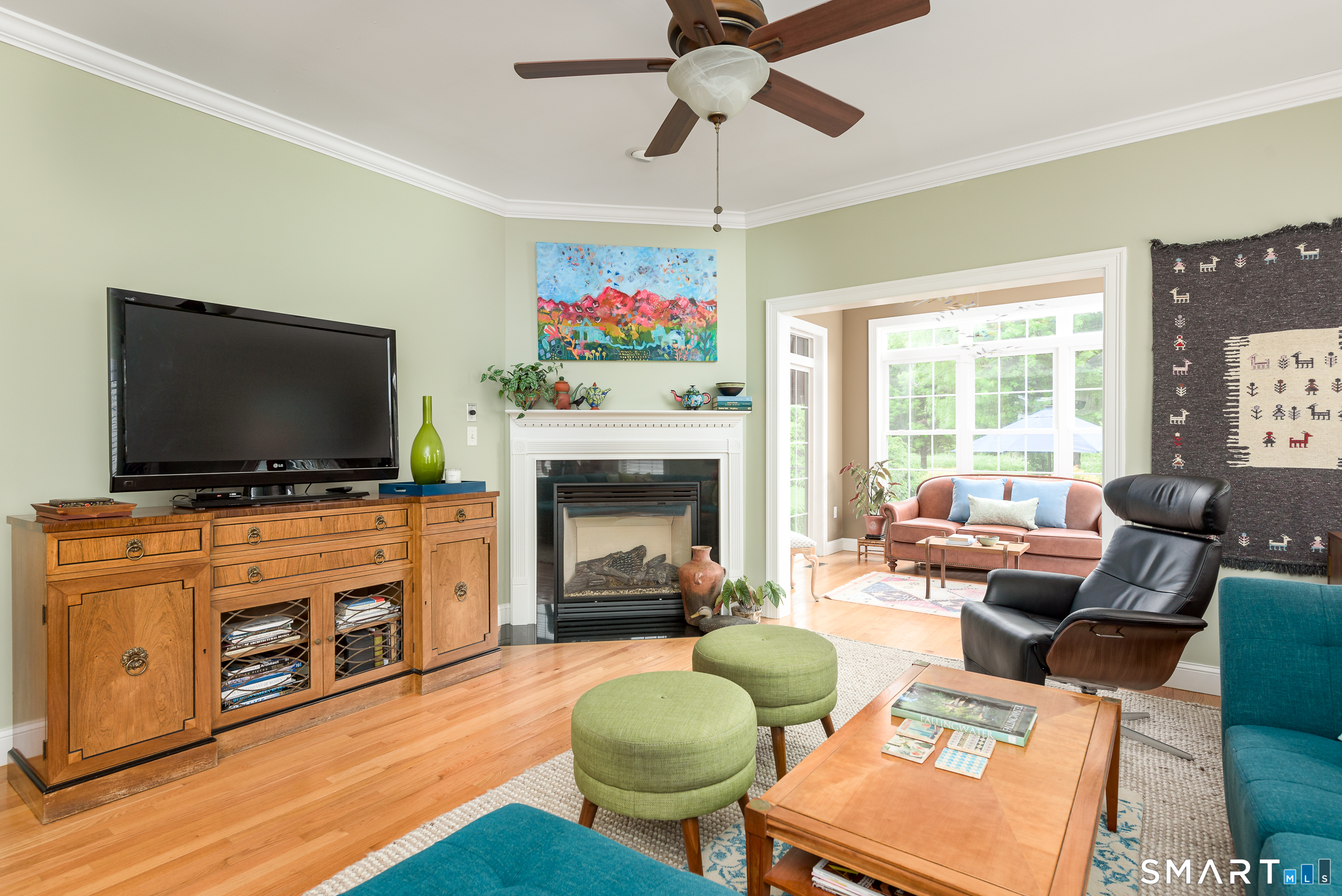 8 Greendale Drive, Unit 8 Suffield, CT 06078 - Photo 8 of 40 a living room with furniture a flat screen tv and a fireplace