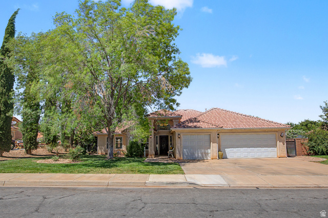 3034 Swiss Drive Santa Clara, UT 84765 - Photo 13 of 59 Terracotta tile roof with a three-car garage