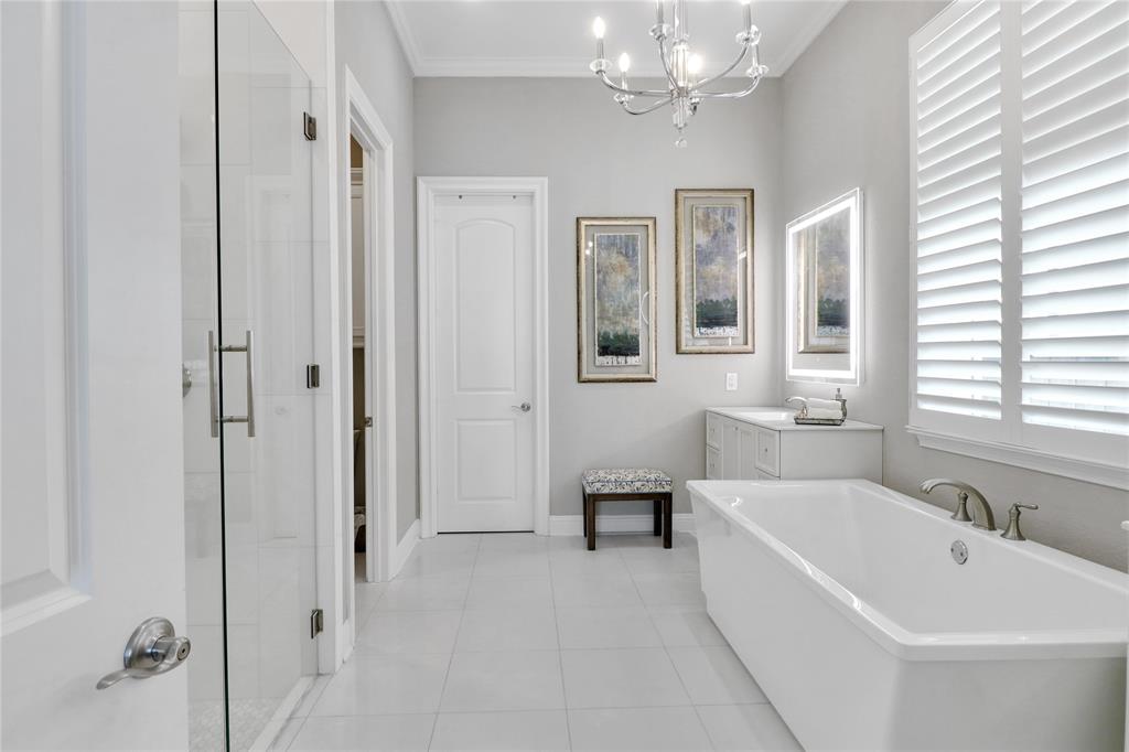 1809 Shade Tree Street Fort Worth, TX 76008 - Photo 12 of 28 Primary Bathroom with double vanities and lighted mirrors. Soaking Tub and Glass Door Shower with White Marble.