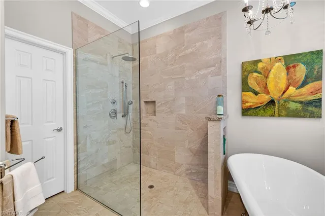 a bathroom with a granite countertop double vanity sink and a mirror