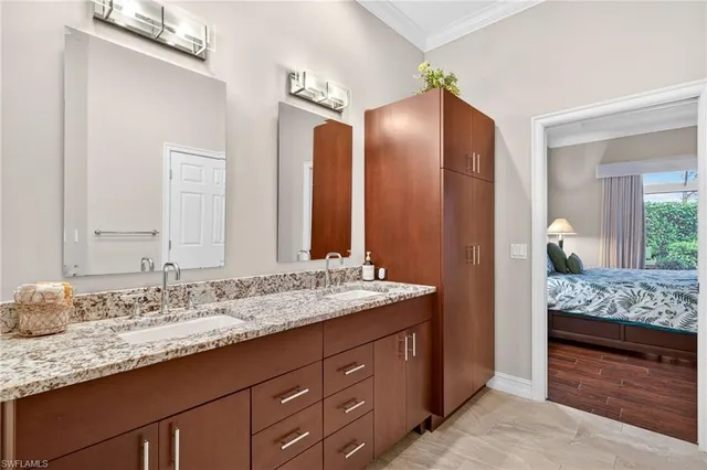 a bedroom with two beds and a dresser