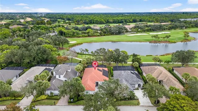 an aerial view of a house with a lake view