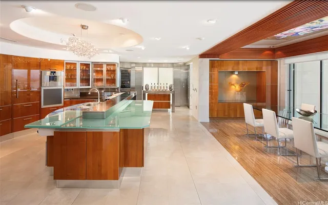 a dining hall with couches a coffee table and chairs with wooden floor