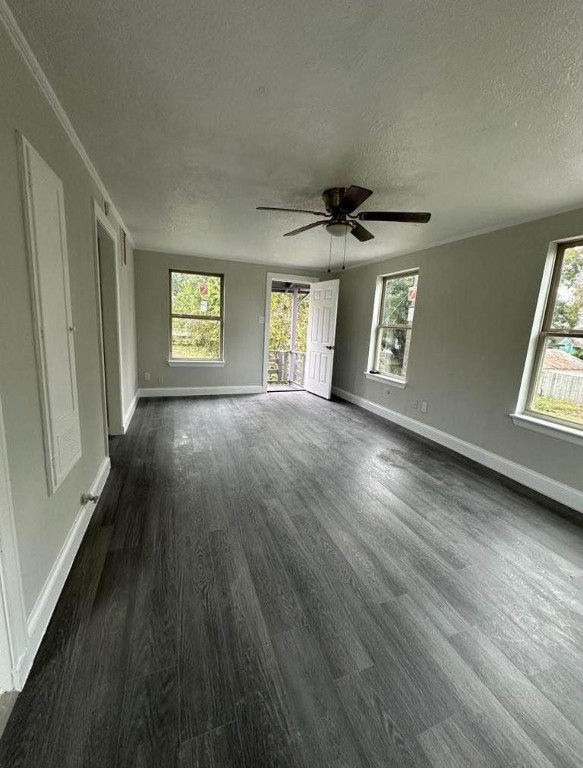702 Rosedale Street, Unit B La Marque, TX 77568 - Photo 3 of 10 a view of an empty room with a window and wooden floor