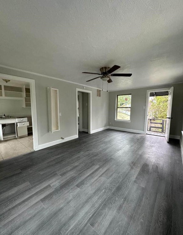 702 Rosedale Street, Unit B La Marque, TX 77568 - Photo 4 of 10 a view of an empty room with a window and wooden floor