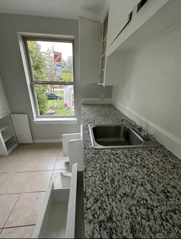 702 Rosedale Street, Unit B La Marque, TX 77568 - Photo 8 of 10 a bathroom with a sink a toilet and a window
