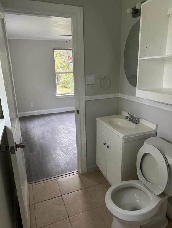 702 Rosedale Street, Unit B La Marque, TX 77568 - Photo 10 of 10 a bathroom with a toilet sink and mirror