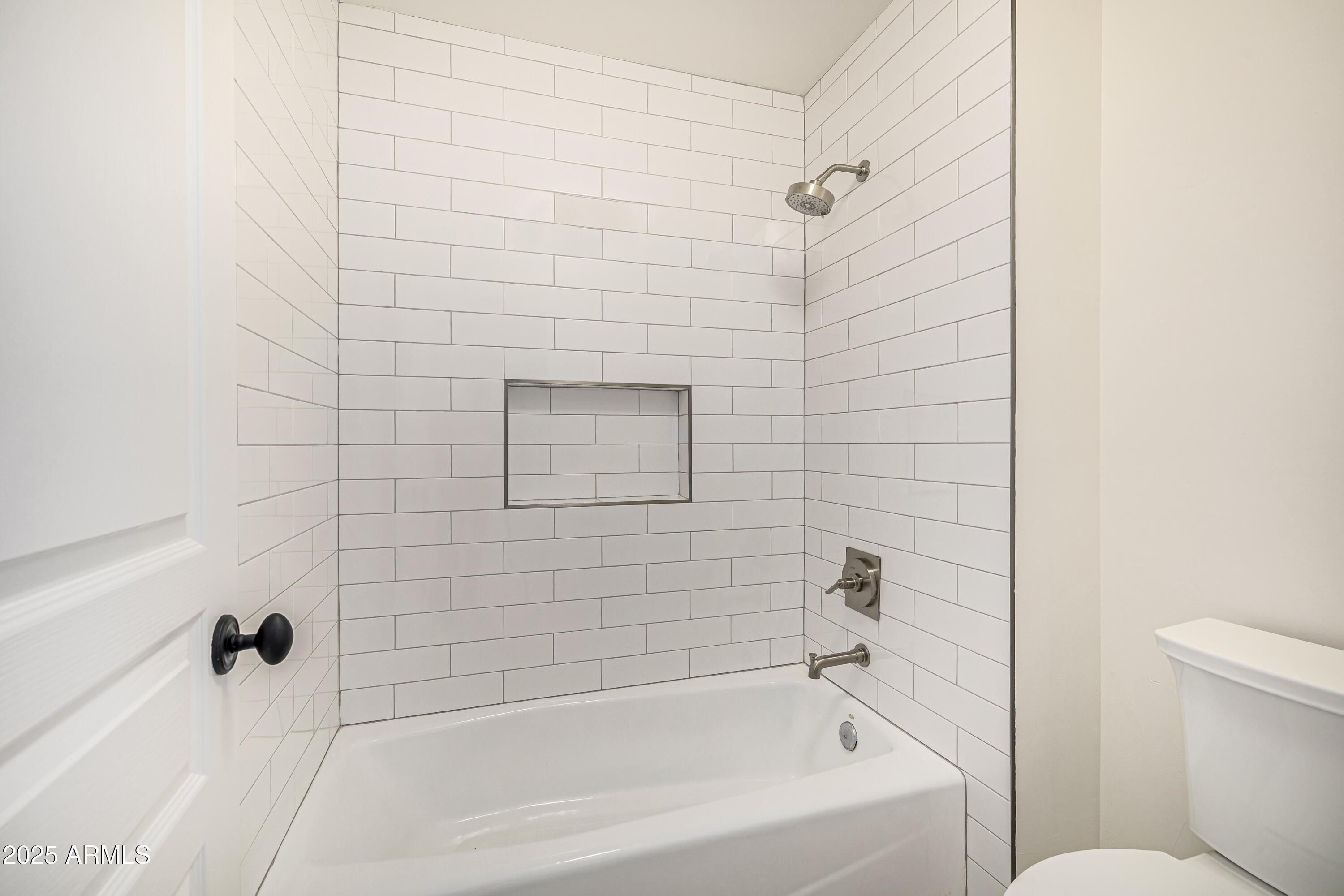 122 West Cottage Lane Tempe, AZ 85282 - Photo 32 of 43 a bathroom with a bathtub and a shower